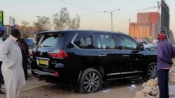 Bullet holes are seen in a car that belong to presidency following heavy gunfire near the president Roch Kabore residence in Ouagadougou, Burkina Faso Jan. 24, 2022.