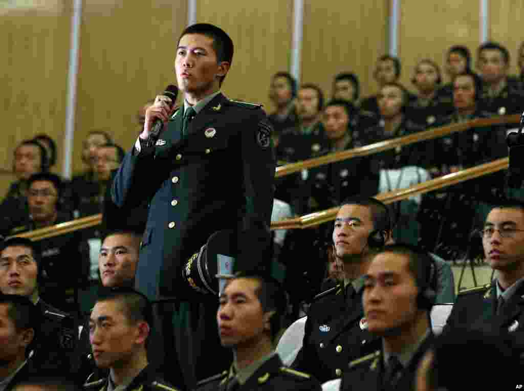 A cadet asks a question to U.S. Secretary of Defense Leon Panetta during his visit to the Engineering Academy of PLA Armored Forces in Beijing, China, September 19, 2012.