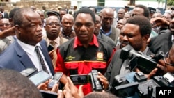FILE - Opposition United Party for National Development president Hakainde Hichilema (C) talks to journalists in Lusaka, March 2, 2016.