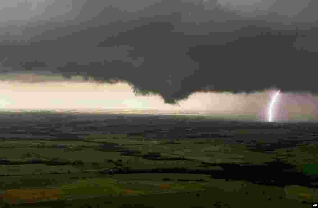 This image provided by KFOR-TV shows storm clouds moving over Guthrie, Oklahoma. 