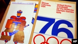 In this Feb. 1, 2018, photograph, one of the posters used in Colorado's effort to secure an Olympic bid in 1976 is part of the memorabilia collection of the Denver Public Library in Denver. 
