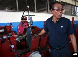 Red shirt businessman Narong Meephet at his machine shop in Udon Thani