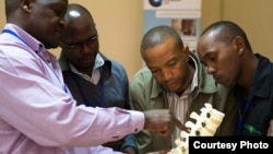 Lancet Commissioner Professor Nyengo Mkandawire from the Malawi College of Medicine teaching at the COOL-funded spine surgery course at AIC-CURE Children’s Hospital in Kijabe, Kenya in April 2014. The spine course was led by Professor Chris Lavy from the Nuffield Orthopaedic Centre in Oxford (also a Lancet Commissioner). 
