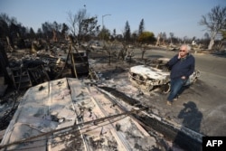 Homeowner Phil Rush reacts as he looks at the remains of his home destroyed by wildfire in Santa Rosa, Calif., Oct. 11, 2017. Rush said he and his wife and dog escaped with only some medication and a bag of dog food when flames overtook their entire neighborhood Oct. 9.