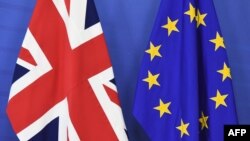 A British flag and an EU flag are set up ahead of British Prime Minister David Cameron's visit at the European Commission in Brussels on Jan. 29, 2016.