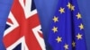 FILE - A British flag and an EU flag are set up ahead of British Prime Minister David Cameron's visit at the European Commission in Brussels, Jan. 29, 2016.