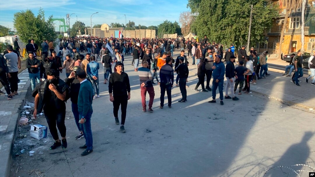 Protestors gather outside the Green Zone government areas in Baghdad, Dec. 3, 2021. Protestors gathered in Baghdad to protest the final results of Iraqi parliamentary elections. 