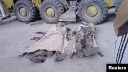 Bodies of government soldiers lie on the ground in the town of Khorog, capital of the autonomous region of Gorno-Badakhshan, in this undated handout picture received by Reuters on July 26, 2012. 