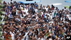 FILE - Ethiopians chant slogans against the government during their march in Bishoftu, Oct. 2, 2016. Dozens of people in the Oromia region were killed that day in a stampede when police tried to disrupt an anti-government protest amid a massive religious festival.