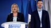 French far-right National Rally (Rassemblement National) party leader Marine Le Pen and Jordan Bardella, the head of the National Rally list for the European elections, sing the national anthem during a meeting in Saint-Paul-du-Bois, France, Feb. 17, 2019