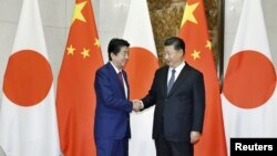 中國國家主席習近平在北京會晤到訪的日本首相安倍晉三。（2018年10月26日)