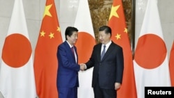 中國國家主席習近平在北京會晤到訪的日本首相安倍晉三。 （2018年10月26日）
