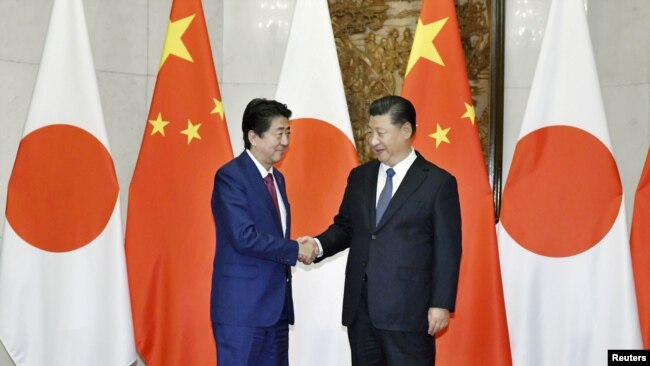 中国国家主席习近平在北京会晤到访的日本首相安倍晋三。(2018年10月26日)