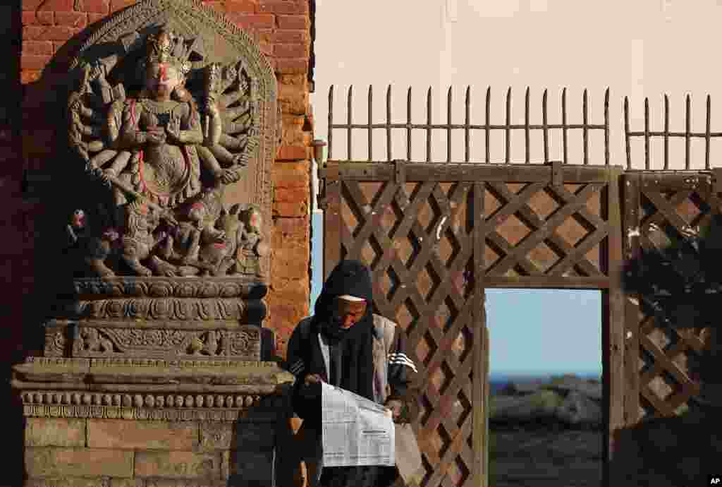 A man reads a newspaper in Bhaktapur, Nepal.