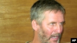 Frans Barnard, employed by the British Save the Children charity, speaks to the media after his release in Adado on October 20, 2010.