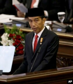 FILE - Indonesian President Joko "Jokowi" Widodo delivers a speech before Parliament members ahead of the country's Independence Day in Jakarta, Indonesia, Aug. 14, 2015.