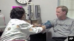 A man is pictured having his blood pressure checked. 
