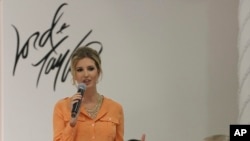 FILE - Ivanka Trump wears an outfit she designed as she speaks to the audience prior to the presentation of her Ready-To-Wear Collection at the Lord & Taylor flagship store in New York, March 28, 2012.