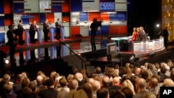 Rick Santorum, left, Chris Christie, Mike Huckabee, Bobby Jindal appear during Republican presidential debate at Milwaukee Theatre in Milwaukee, Wisconsin, Nov. 10, 2015.