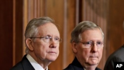 FILE - Senate Majority Leader, Democrat Harry Reid of Nevada, and Senate Minority Leader and Republican Mitch McConnell of Kentucky, right,.