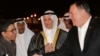 U.S. Secretary of State Mike Pompeo shakes hands with Ambassador Reem Al-Khaled, as he arrives at Kuwait International Airport in Kuwait City, Kuwait, March 19, 2019. 