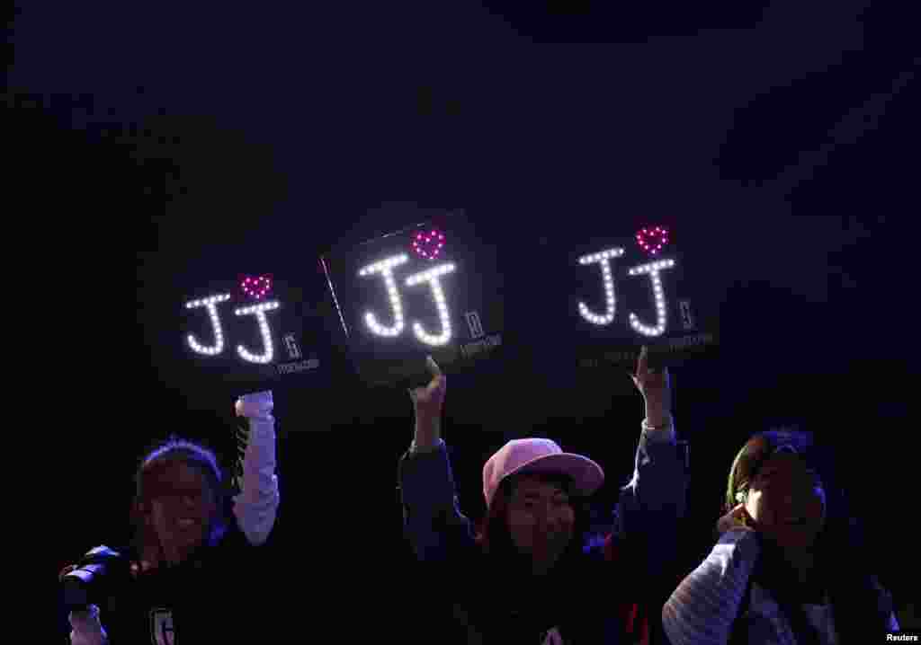 Fans of Johnny Depp hold banners as he attends a red carpet event to promote his new movie &quot;Transcendence,&quot; on his first visit to China, Beijing.