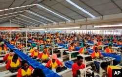 FILE - Ethiopian factory workers produce shoes at the Chinese company Huajian's plant in the Lebu Industrial complex near Addis Ababa, Ethiopia, Jan. 5, 2017.