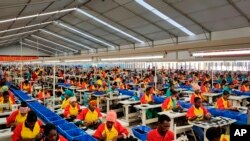 FILE - Ethiopian factory workers produce shoes at the Chinese company Huajian's plant in the Lebu Industrial complex near Addis Ababa, Ethiopia, Jan. 5, 2017.