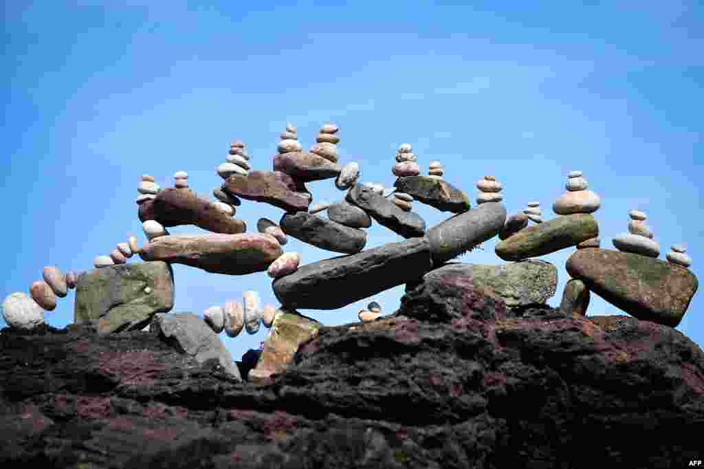 A balanced sculpture is seen during the European Stone Stacking Championships 2019 in Dunbar, Scotland.
