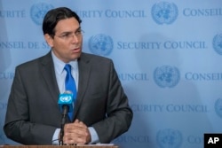 Israel's Ambassador Danny Danon speaks to reporters outside the Security Council chambers, July 24, 2017 at United Nations headquarters.