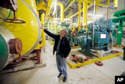 Utah Olympic Oval Maintenance Manager Greg Warner walks through the recently renovated ice plant at the Utah Olympic Oval on Dec. 18, 2018, in Kearns, Utah.