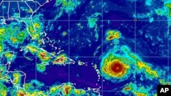 This Sept. 4, 2017, satellite image provided by the National Oceanic and Atmospheric Administration shows Hurricane Irma nearing the eastern Caribbean. Hurricane Irma grew into a powerful Category 4 storm Monday.