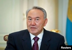 FILE - Kazakhstan's President Nursultan Nazarbayev attends a meeting at his office in Almaty, Feb. 25, 2013.