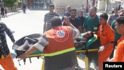 A man is brought to a hospital on a stretcher after after being wounded in a clash between Iraqi forces and Sunni Muslim protesters in Kirkuk, 250 km (155 miles) north of Baghdad, April 23, 2013.