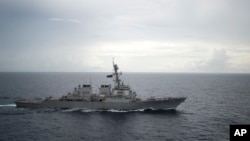 FILE - Photo provided by the U.S. Navy shows the guided-missile destroyer USS Decatur (DDG 73) operating in the South China Sea as part of the Bonhomme Richard Expeditionary Strike Group (ESG), Oct. 13, 2016.