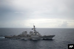 FILE - Photo provided by the U.S. Navy shows the guided-missile destroyer USS Decatur (DDG 73) operating in the South China Sea as part of the Bonhomme Richard Expeditionary Strike Group (ESG), Oct. 13, 2016.