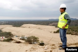 Giovanni Palacios, director and lead engineer of the Olmos Irrigation Project, watches a construction area of the project in Lambayeque, March 15, 2013.