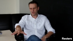 FILE - Russian opposition leader Alexei Navalny speaks during an interview, July 12, 2017, with Reuters in Moscow.