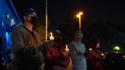 People light candles as they attend a peace vigil to mourn the victims of anti-Asian hate crimes at Almansor Park, Alhambra, California, U.S., March 21, 2021.