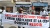 Protesters gather outside the Gambian Embassy in Senegal on August 30, 2012. The banner reads : " Stop summary executions. The African Union and ECOWAS must react." 