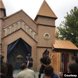 Bagpipe player, Nate Silva, and drummer play at a Maryland Renaissance Festival.