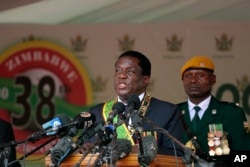 FILE - Zimbabwe's President Emmerson Mnangagwa delivers his speech during the 38th anniversary of Independence celebrations at the National Sports Staduim in Harare, Apr. 18, 2018.