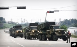 South Korean army's armored vehicles move in Yeoncheon, south of the demilitarized zone that divides the two Koreas, Aug. 22, 2015.