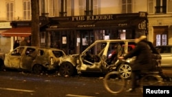 Burned cars are seen on avenue Kleber after clashes with protesters wearing yellow vests, a symbol of a French drivers' protest against higher diesel taxes, in Paris, France, December 1, 2018.