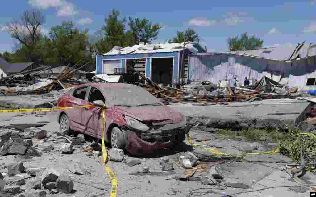 Tornado damage is surveyed in Quapaw, Oklahoma, April 28, 2014.