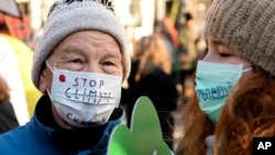 Climate activists attend the March for Climate in a protest against global warming in Katowice, Poland, Saturday, Dec. 8, 2018, as the COP24 UN Climate Change Conference takes place in the city.