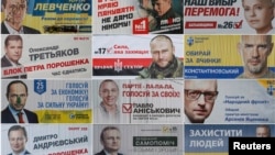 A combination photo shows pre-election posters as they are seen on the streets of Kyiv, Oct. 22, 2014. Ukrainians will take part in an early parliamentary election on October 26.