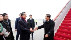 Chinese State Councilor and Foreign Minister Wang Yi welcomes Cambodian Prime Minister Hun Sen as he arrives at the Beijing Capital International Airport in Beijing, China February 5, 2020. China Daily via REUTERS ATTENTION EDITORS - THIS IMAGE WAS PROV