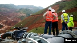 FILE - Employees stand in an open pit at Banro's Twangiza mine in eastern Congo.