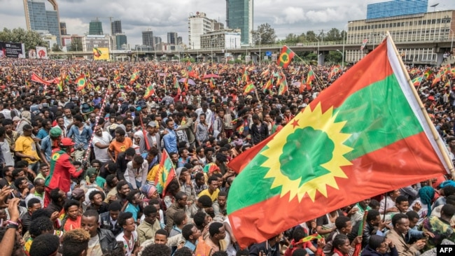 FILE - People gather to celebrate the return of the formerly banned anti-government group the Oromo Liberation Front (OLF) at Mesquel Square in Addis Ababa, Ethiopia, Sept. 15, 2018.